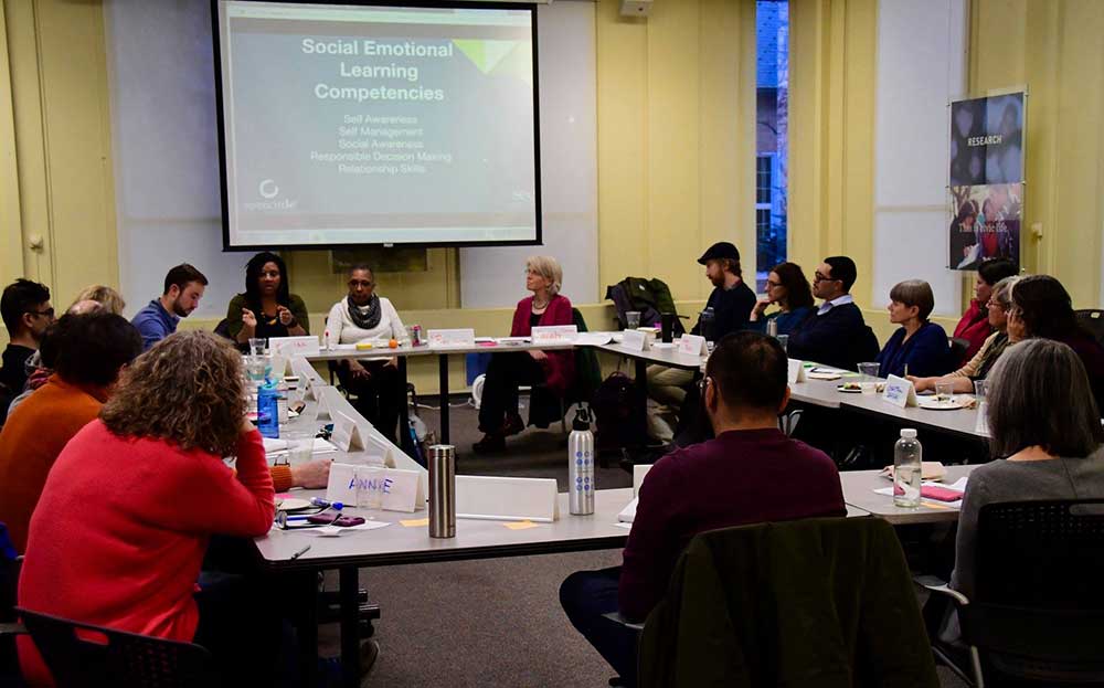Kamilah Drummond-Forrester, Gail Cruise-Roberson, and Sarah Fiarman (L-R, far side of table)